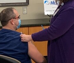 From left, hospital spokeswoman Magen Samyn, Director of Pharmacy David Haugh, RN Lori Skrzysinski, and Dr. Rajesh Dandamudi discuss the new COVID-19 vaccine.