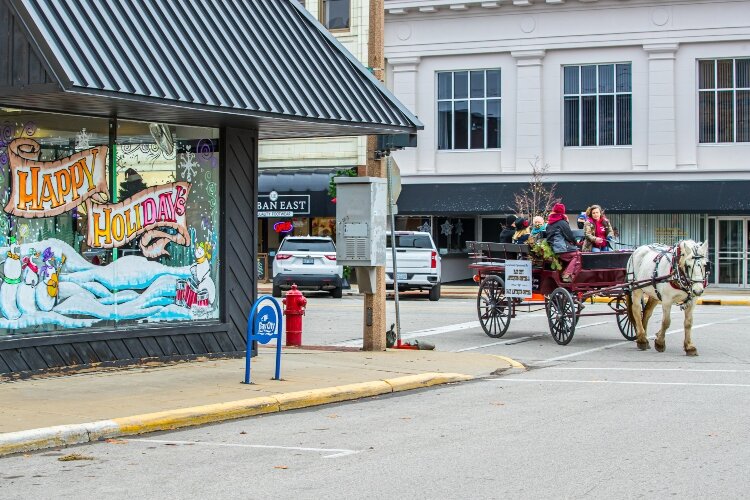 Wreaths, window displays, and holiday lights fill the streets of Downtown Bay City with the holiday spirit.