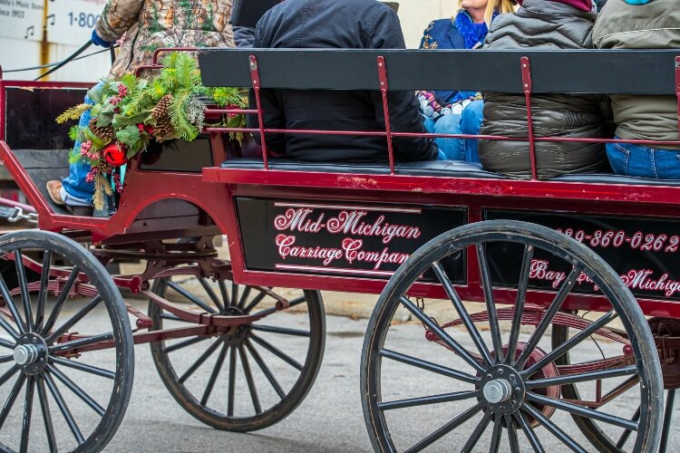 Walking through the downtown while wearing a face mask lets people enjoy the holidays while slowing the spread of COVID-19.