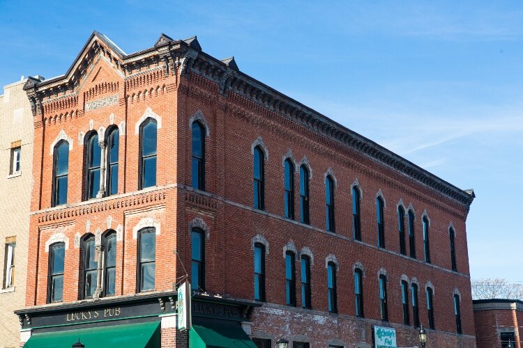 Located at the northwestern intersection of Midland and South Linn streets is the Mosher building. George Mosher built this location in 1882 and it stands out as a prominent structure on Midland Street. 