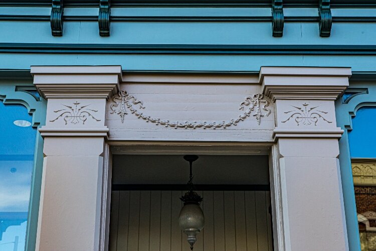 The Commercial Italianate style features stone and masonry details on the front and side of the building. 