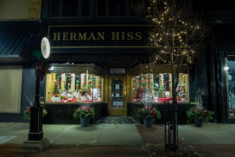 Lights and color shine from the display windows at Herman Hiss & Co., 905 Washington Ave. 