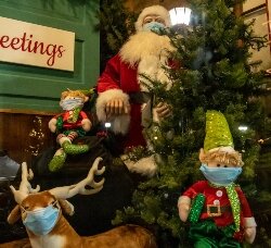 In the window of Little House, 924 N. Water St., Santa and his elves are donning masks to slow the spread of COVID-19 during the holidays.