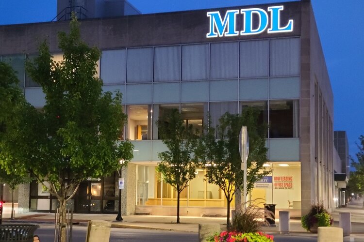 Mike Loomis and his family settled their company in the old PNC Bank Building at 310 Center Ave., in the heart of Downtown Bay City.