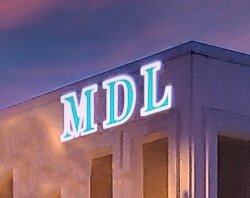 Mike and Pam Loomis say they see great things in Bay City's future. His sons – from left, Jared, Justin, and Brandon – do too, so they're choosing to return to Bay City to begin their careers.