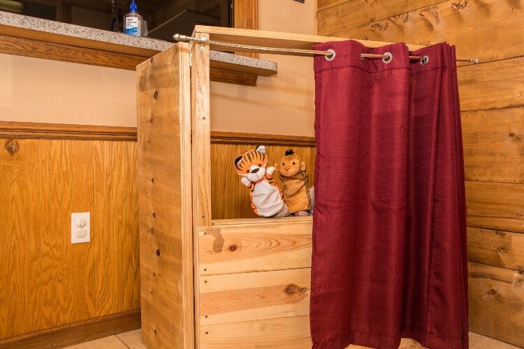 Dean worked with Property Manager Markus Gonzales to design and build a puppet theater for patients at the center.