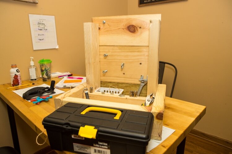 Nuts and bolts are two of the tools in use at the therapy center.