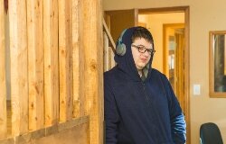 Tristan Dean was once a patient at Game Changer Pediatric Therapy Services. Today, the 19-year-old is an employee, working as the assistant to the property manager. One of his first duties was to build a wooden frame so this puzzle could be displayed