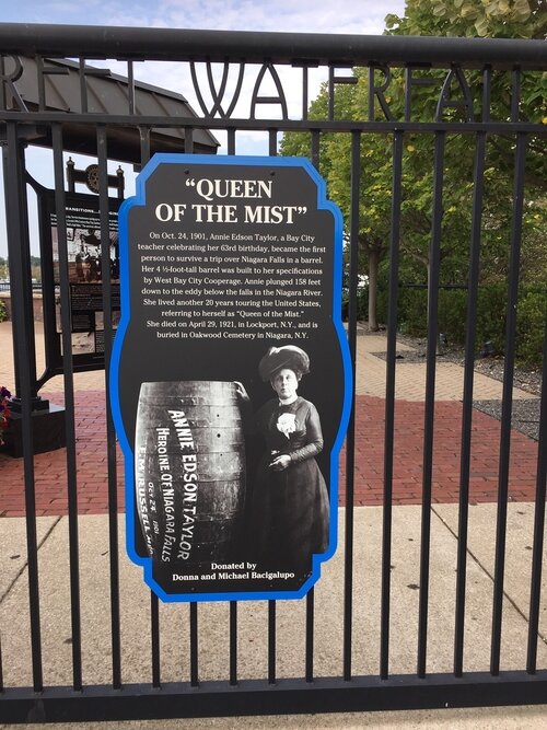 A plaque at the Third Street Waterfall Park tells the story of Bay City’s Annie Edson Taylor. Taylor is the first person to successfully plunge over Niagara Falls in a barrel.