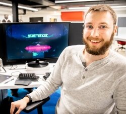 After four years of working to build a new video game, Starmancer, Tyler Millershaski celebrates that independent game developer and publisher Chucklefish plans to release it to the public later this year.