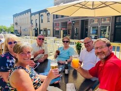 Colorful balls light up Saginaw Street outside several restaurants and coffee shops.