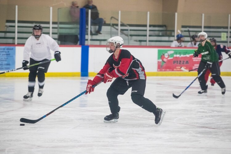 Ashley Brown is the unofficial recruiter for the women’s hockey league.
