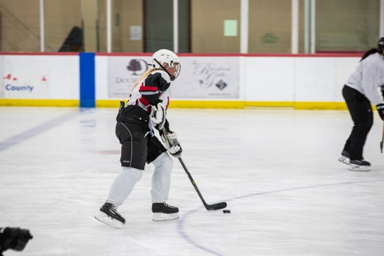 Growing numbers of girls and women, including Paige Churchfield, are discovering the fitness and fun of ice hockey.