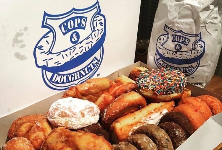 Here’s a free hint from a local: Stop at Cops & Doughnuts late in the afternoon and you’re likely to score a special price on a box of donuts as they clear their shelves before closing.