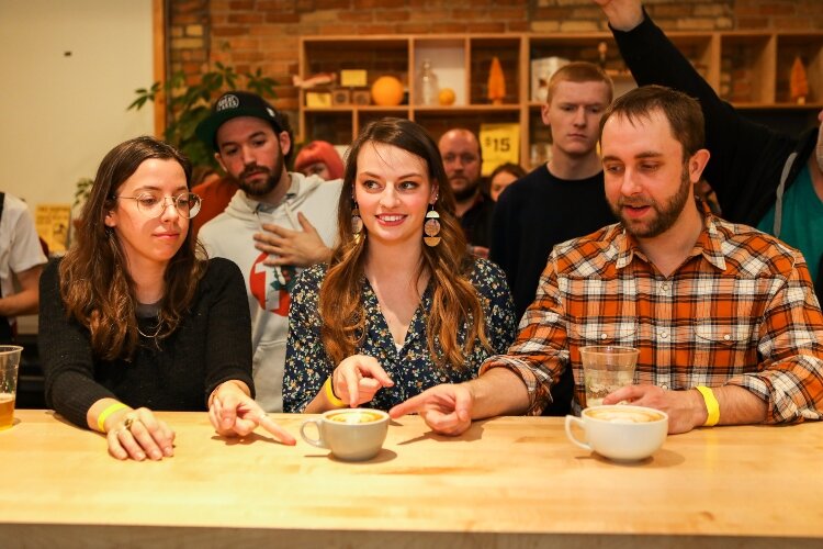 The judges – Alicia Cunningham, at left, and Sarah Bogert, middle, from Populace Coffee and Andy Vickers, right, of Birmingham Roast ¬– closed their eyes as the baristas put their work on the counter, then each judge pointed to a favorite.