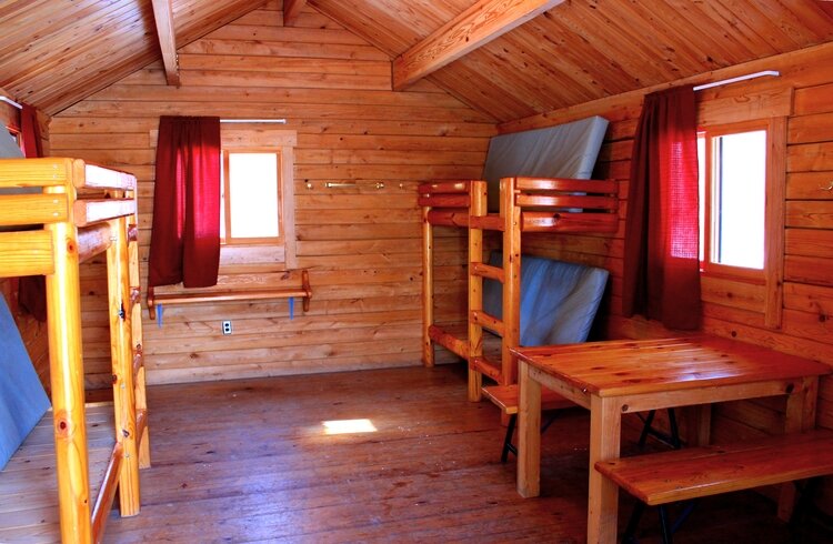 Bring board games, puzzles, and books to make the most of family time inside one of the 6 cabins available for rent in Pinconning Park.