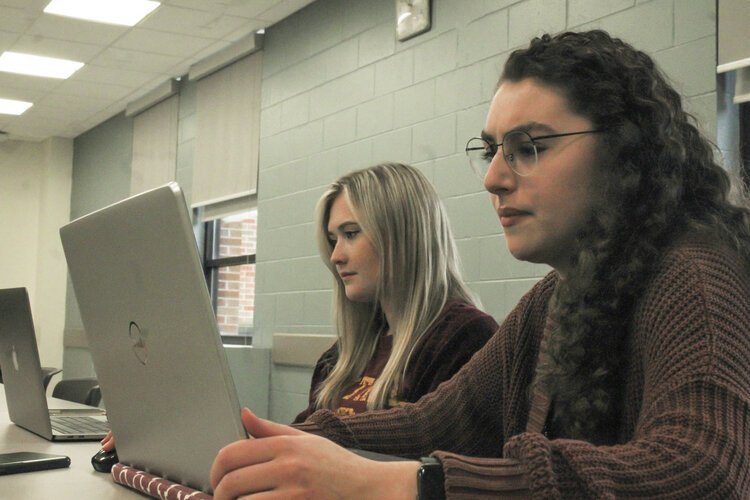 Samantha Ovresat and Sarah Miller participate in a digital game of capture the flag at Central Michigan University. Denise McBride, senior lecturer in the Business Information Systems Department at CMU, hopes women become more active in the field.