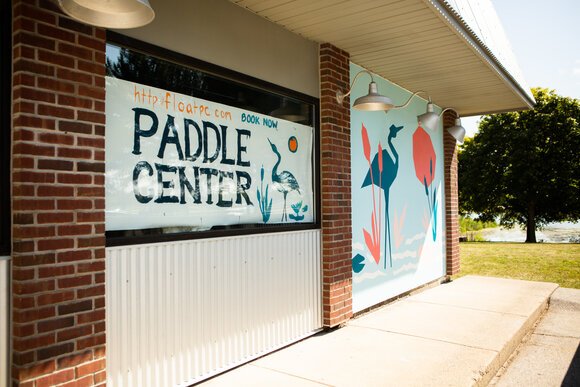The Float Paddle Center sits near walking and biking trails along the Saginaw River, but also near a business district filled with stores and offices.