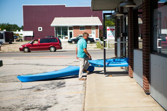  Cars drive past one side of the Float Paddle Center, but a grass- and tree-filled park leads to the Saginaw River on the other side of the building, located in the Salzburg Avenue business corridor.