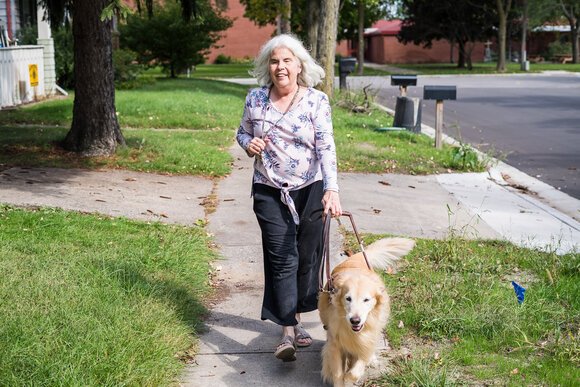 Cheryl Wade and her dog out for a walk in Midland.