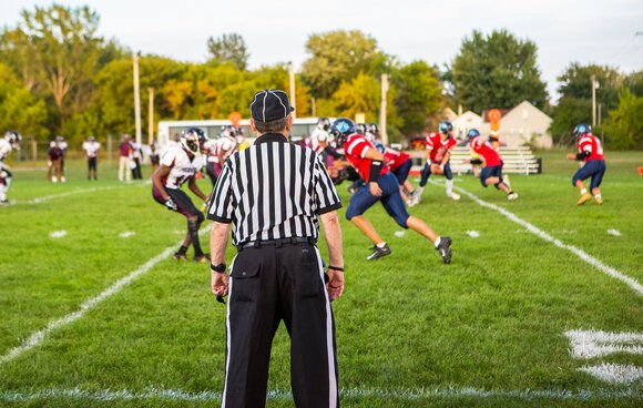 The first varsity game Rose officiated was at Kinde North Huron High School in 1970. 