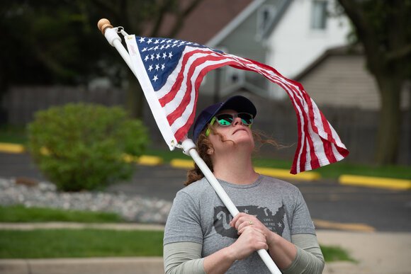 Raise a Flag relies on a team of volunteers to put the flags up every spring and take them down for the winter.