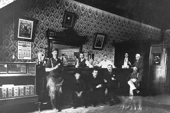 Patrons pose inside the New European Hotel at Third and Water Streets in Bay City. The building is now home to St. Laurent Brothers. 