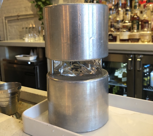 An aluminum mold transforms 2-by-2-inch cubes of ice into spheres, the perfect finishing touch for a craft cocktail.