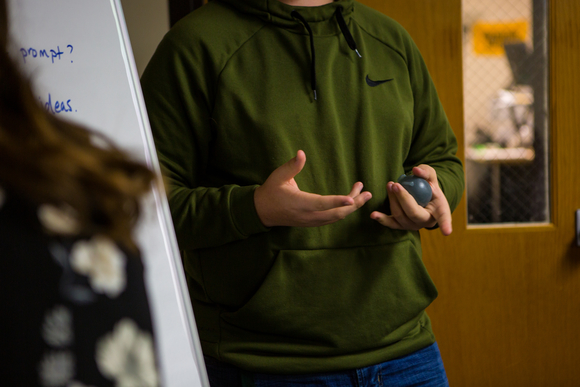 Students pass a "talking toy" around to keep track of whose turn it is to speak during a recent SPIRIT Council meeting.