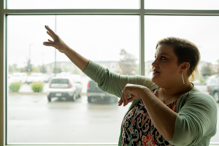 Alayna Wesener planning the layout of her storefront, located directly underneath CMURC