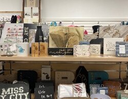 Gift shop owner Capri Wisniewski and her family made and installed flooring, fixtures, and murals in the new space.