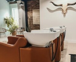 Megan Phillips, at left, and Amanda Rupprecht, friends since high school, opened the Artistry Lounge Hair Studio this month in Downtown Bay City.