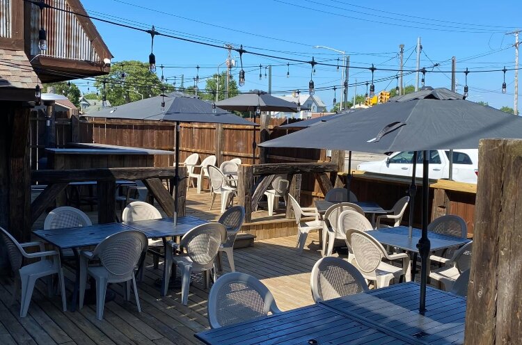 Music, drinks, and meals were offered on an outdoor deck when the weather cooperated. Since 2020, a large tent has covered the deck and extended the outdoor dining season.