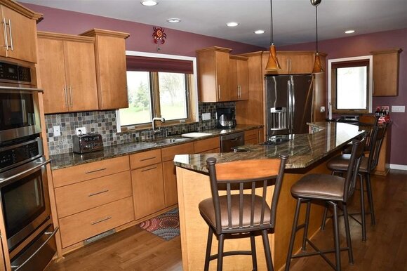 At 2,728 square feet and with 15 acres of land, this home feels like an estate.