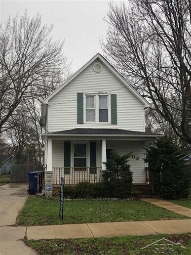 Located west of the Saginaw River, this 1872-built home features a large backyard and multi-tiered deck.