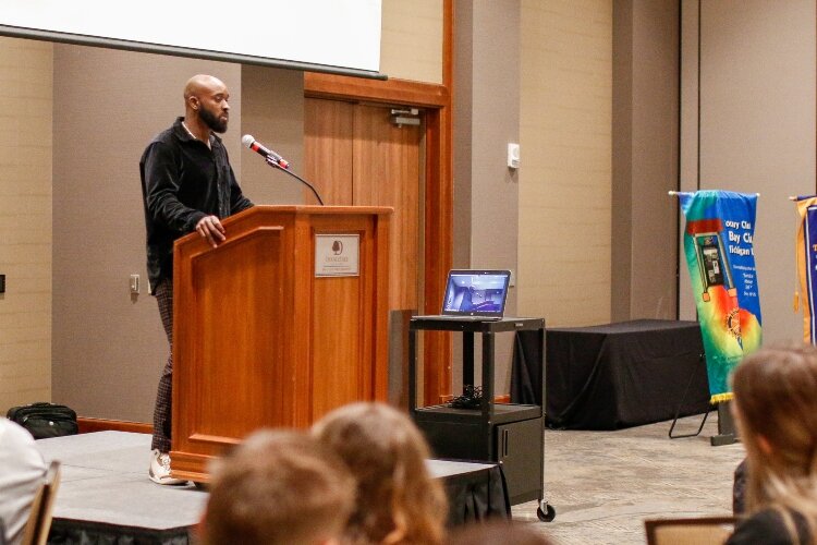 Trenton Robinson, a Bay City Central graduate and former NFL player, talks during Rotary Vocational Days about the importance of perseverance and never giving up. (Photo courtesy of Emily Woodruff Photography)