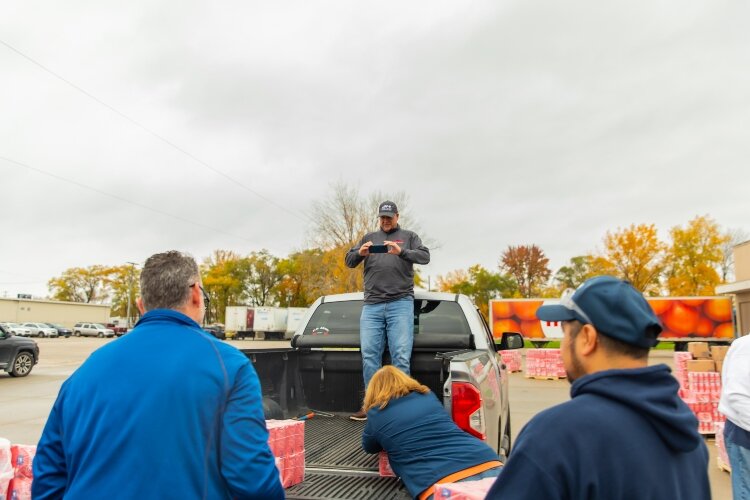 Rob Clark from Michigan Sugar climbed into a truck bed to capture a photo of some of the volunteers.