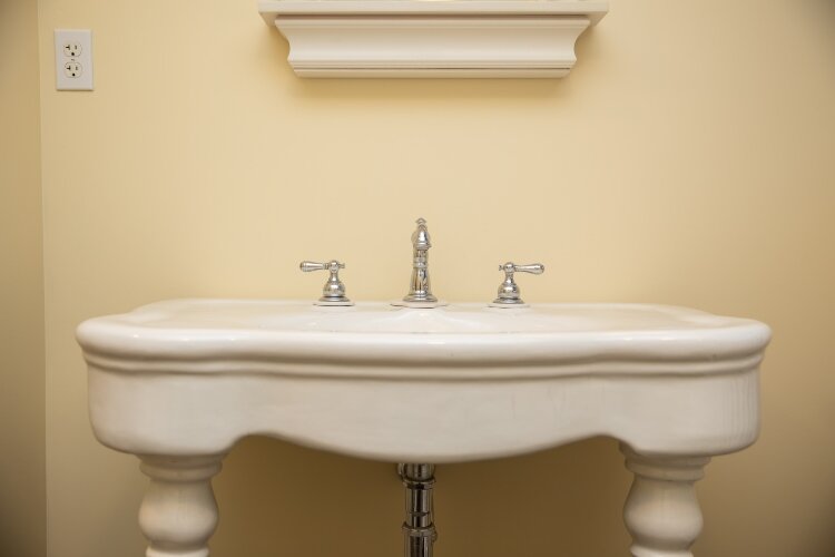 This porcelain sink is rumored to have been part of the original structure.