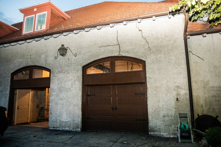 What were once stable doors are now entrances to a garage.
