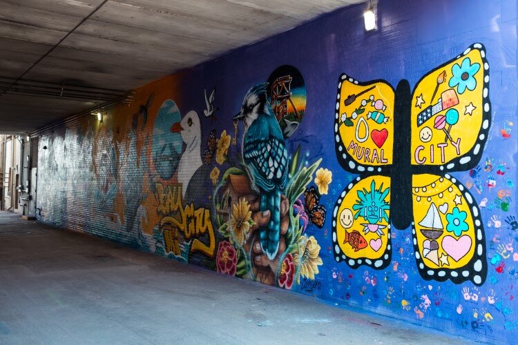 United We Go invited ten artists to create eight murals in an downtown alley.