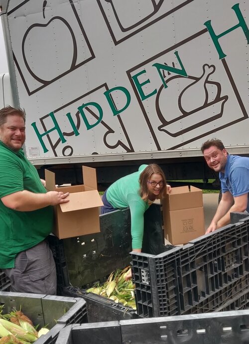 Samantha McKenzie, center, says support from the United Way of Bay County is central to Hidden Harvest fulfilling its mission. McKenzie is the President & CEO of Hidden Harvest. (Photo courtesy of Hidden Harvest)