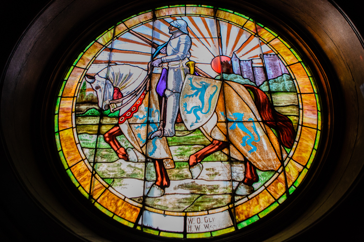 Light shines through stained glass windows throughout the Historic Masonic Temple. (Photo Credit: Ashley Brown)