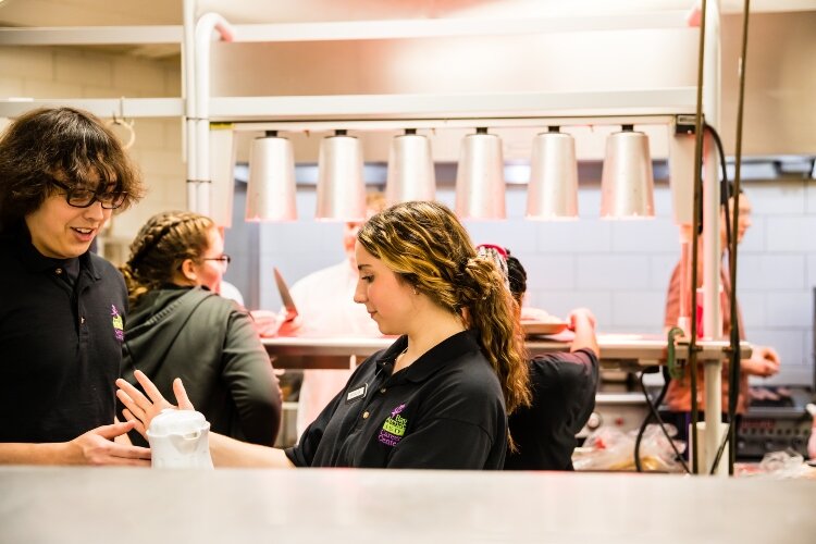 The students rotate through the different jobs, learning the full scope of running a restaurant.