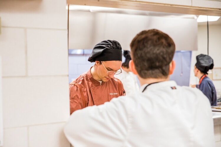 The students work together to serve diverse meals at Blooming Chefs.