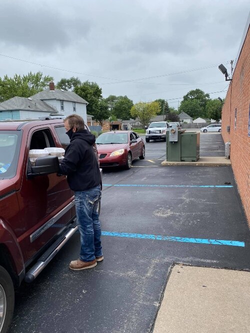 Since 2020, Bay City Food of Faith-West has served take-out meals to people who drive into the Messiah Evangelical Lutheran Church parking lot. (Photo courtesy of Bay City Food of Faith-West)