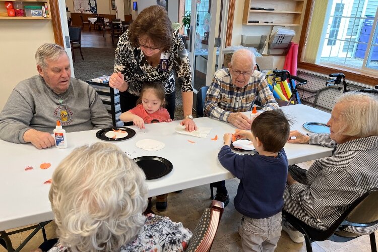 Seniors benefit from the energy of their young visitors. The kids get a chance to practice language skills alongside small motor skills. The primary reason for the visits, though, is to enjoy each other's company.