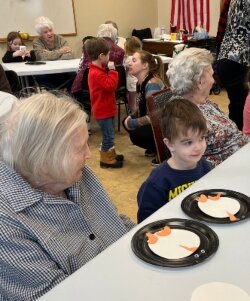 Crafts are the first item on the agenda when pre-schoolers from the Montessori Children's House of Bay City visit the residents of New Hope Bay  Assisted Living and Memory Care Community.