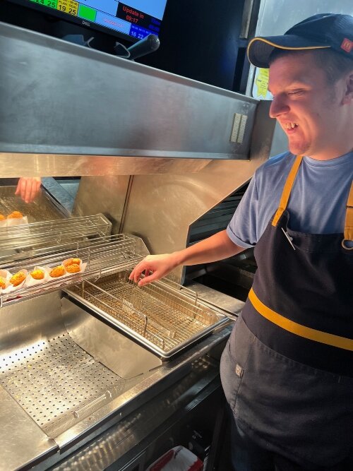 Stephen Bauer says that between working at McDonald's, volunteering for Bay County TV, and attending local musical events, he stays busy and happy.