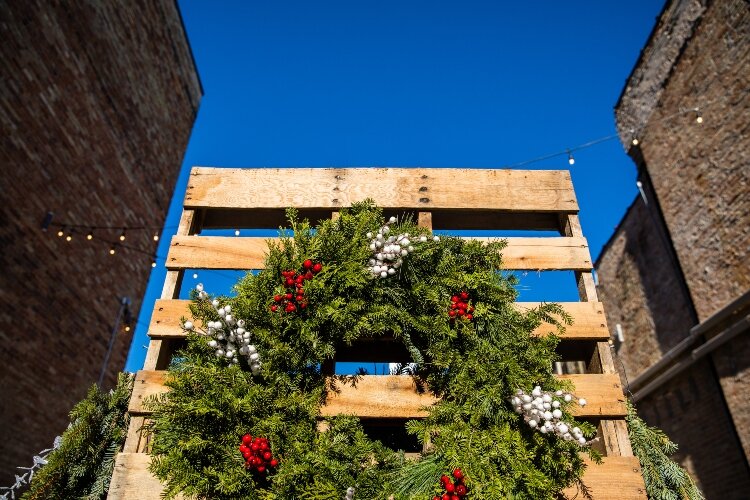 Lights shine at night, while bright sunshine illuminates holiday decor during the day.