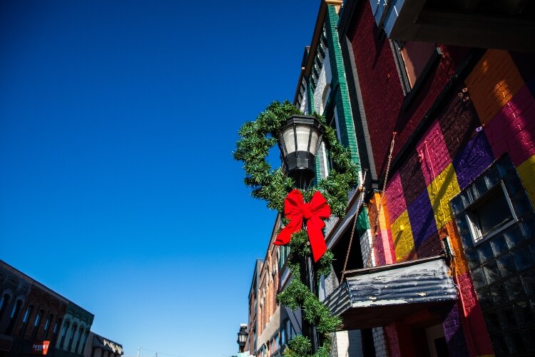 The fragrance of fresh pine fills the air of the downtown district.